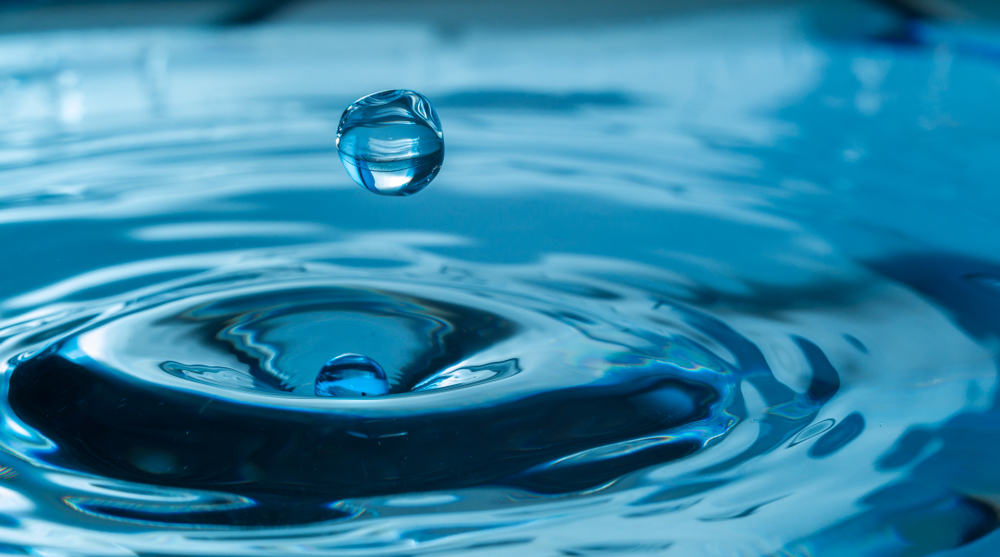 Close-up of water droplet and ripple effect representing water treatment and supply infrastructure for the Fitzroy to Gladstone Pipeline Readiness Program in Queensland.